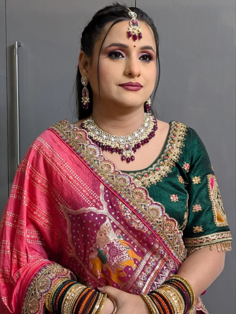 Front portrait with pink and green occasion styling and softly defined makeup.