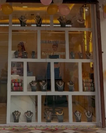 Jewellery sets and bangles displayed in the SRS Punawale shop window.